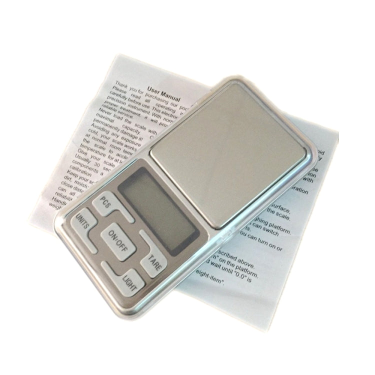 Portable digital scale with user manual insert and blue LCD keypad controls