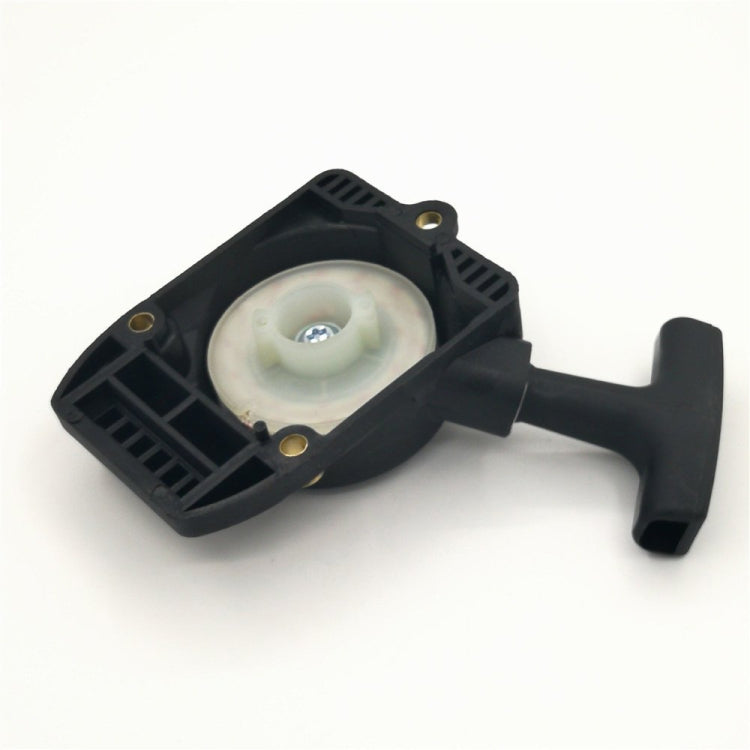 Black starter housing underside with pull handle, circular recoil insert, and brass mounting holes