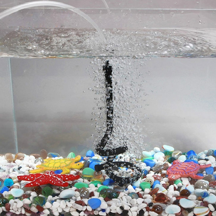 Aquarium bubble diffuser with rising air stream from a black hose nozzle