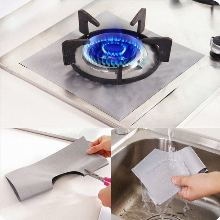 Gas burner lit with blue flame over protective pad sheets