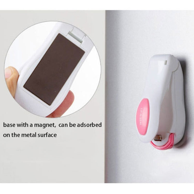 Magnetic base mini heat sealer with white body and pink pad, wall-mount style
