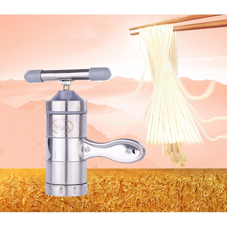 Stainless steel noodle maker with lever handle extruding long white noodles