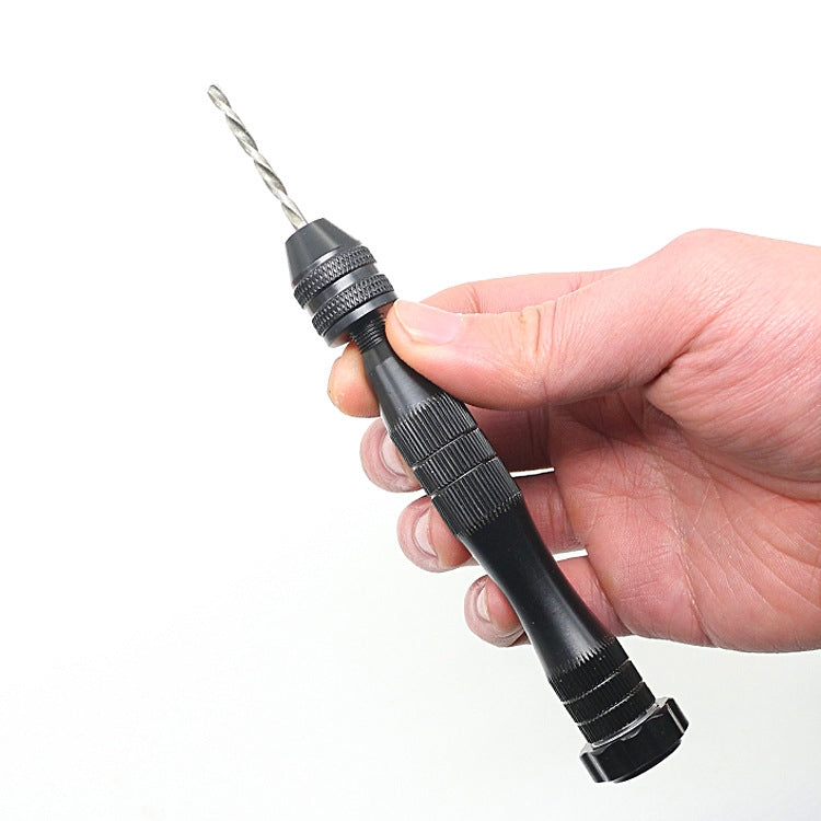 Handheld mini drill in black with pointed bit and knurled grip for precision work