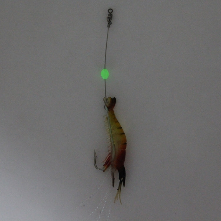 Shrimp-shaped fishing lure with hook, yellow-red body, glowing green bead
