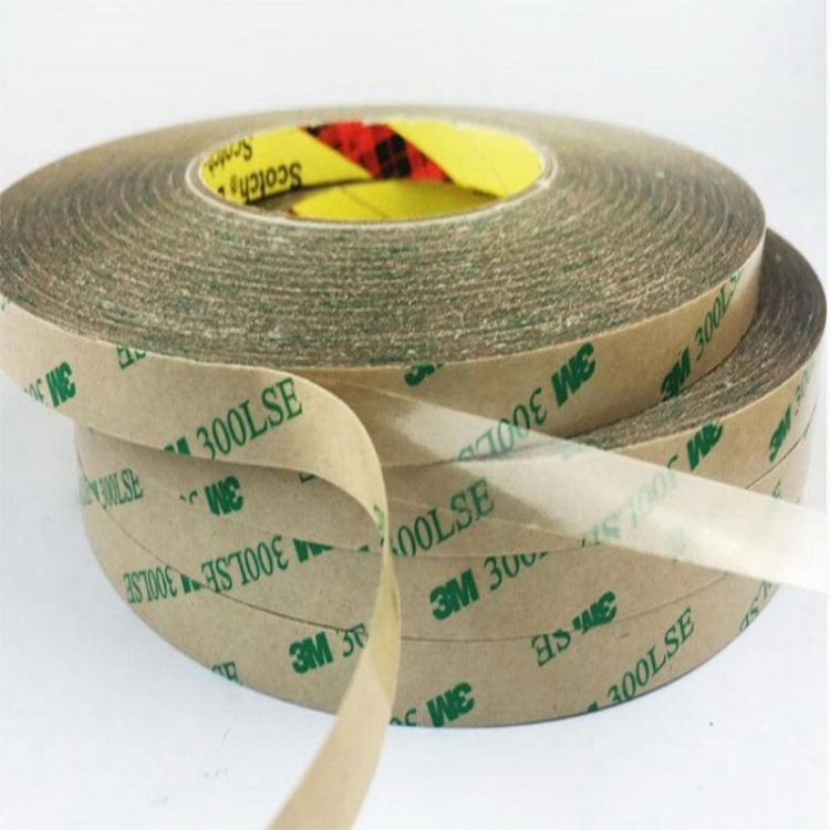 Close-up of transparent double-sided tape on brown backing, rolled strip with liner