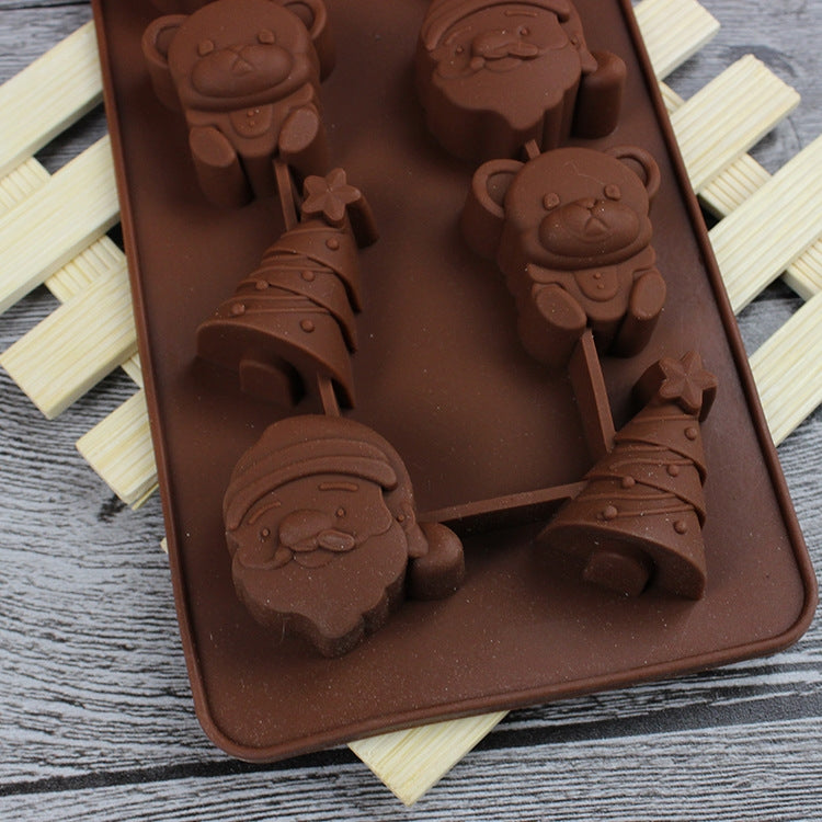 Silicone ice and dessert mold tray with Santa and star shapes, dark brown