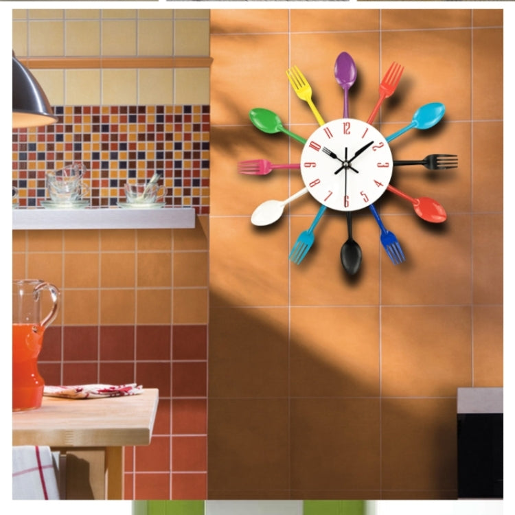 Wall-mounted utensil clock with colorful forks and spoons around a white dial with black hands