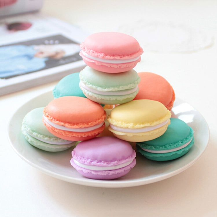 Stack of pastel macaron-style medicine storage boxes on a plate