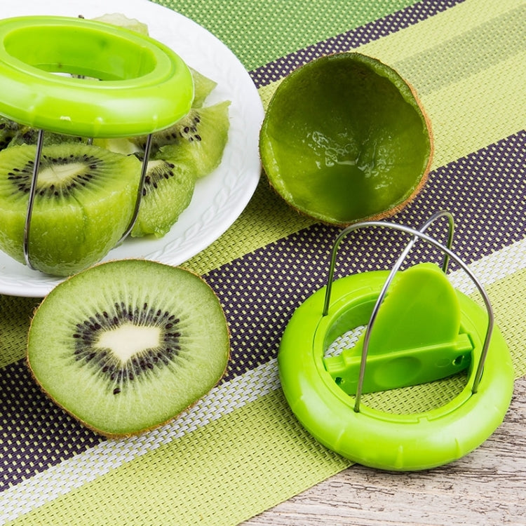 Kiwi fruit peeler set: green ring tool and kiwi halves on plate and cutting mat