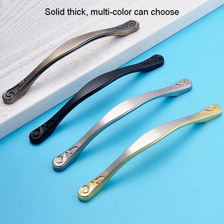Multi-color double-arched cabinet handles: black, silver, and gold with scroll ends