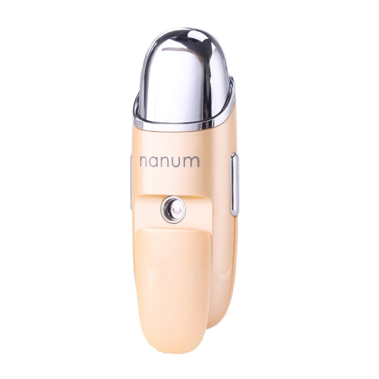 Peach handheld facial misting massager with chrome top and round front button