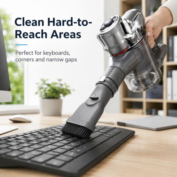 Vacuum brush head with hard bristles reaching between keyboard keys