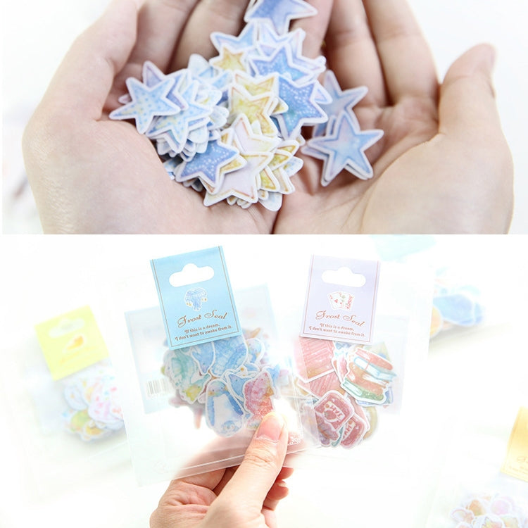 Star-shaped PVC stickers in pastel colors, held in hands with sealed packs below