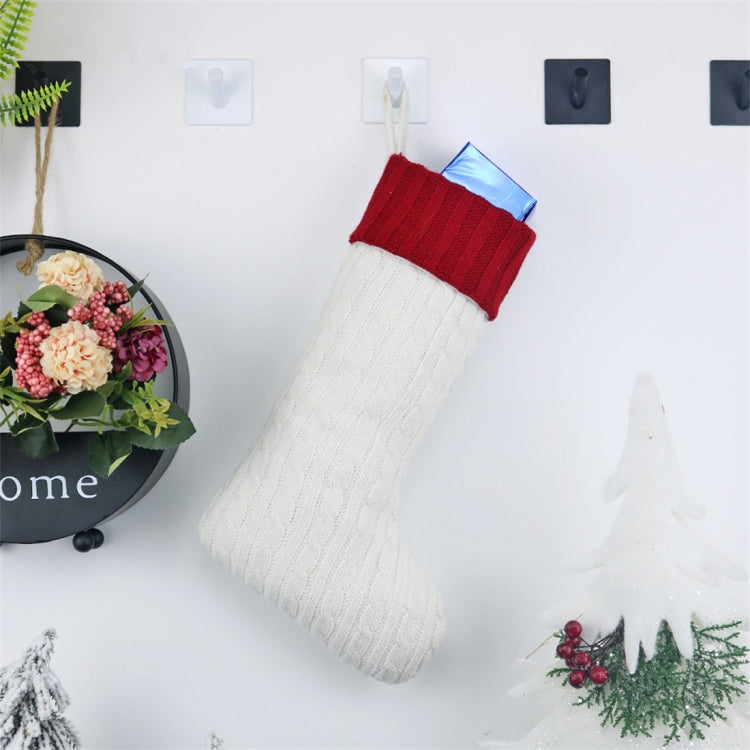 Knitted Christmas gift sock decoration, white leg with red ribbed cuff and hanging loop