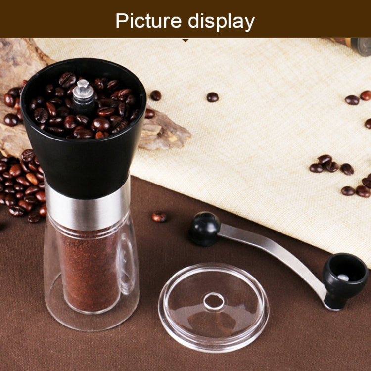 Manual conical burr coffee grinder with clear lid container and side handle