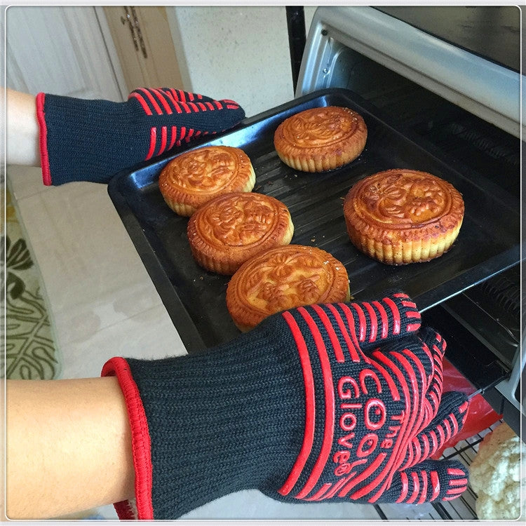 Heat-resistant BBQ glove holding a tray of baked pies in an oven