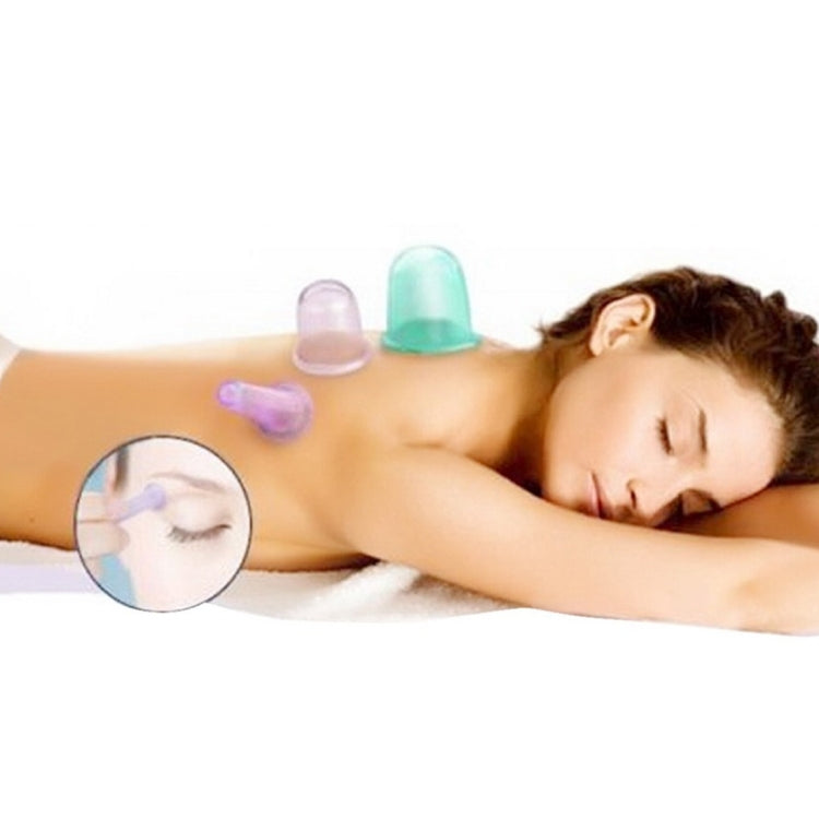 Silicone cupping cups in pastel colors attached to skin for vacuum massage