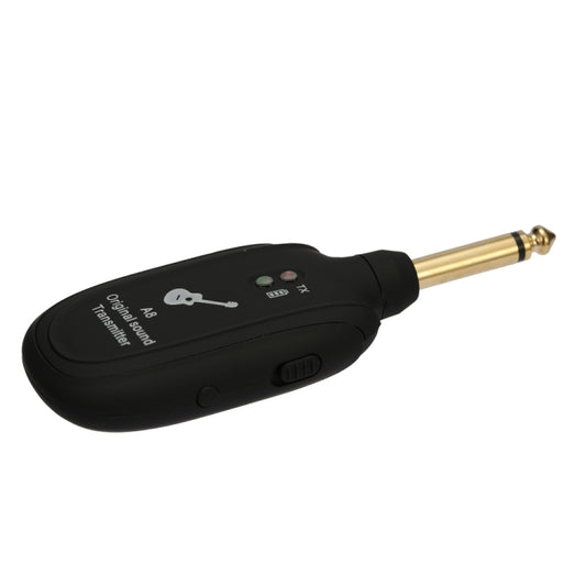 Black guitar wireless transmitter unit with gold 1/4-in plug and control buttons