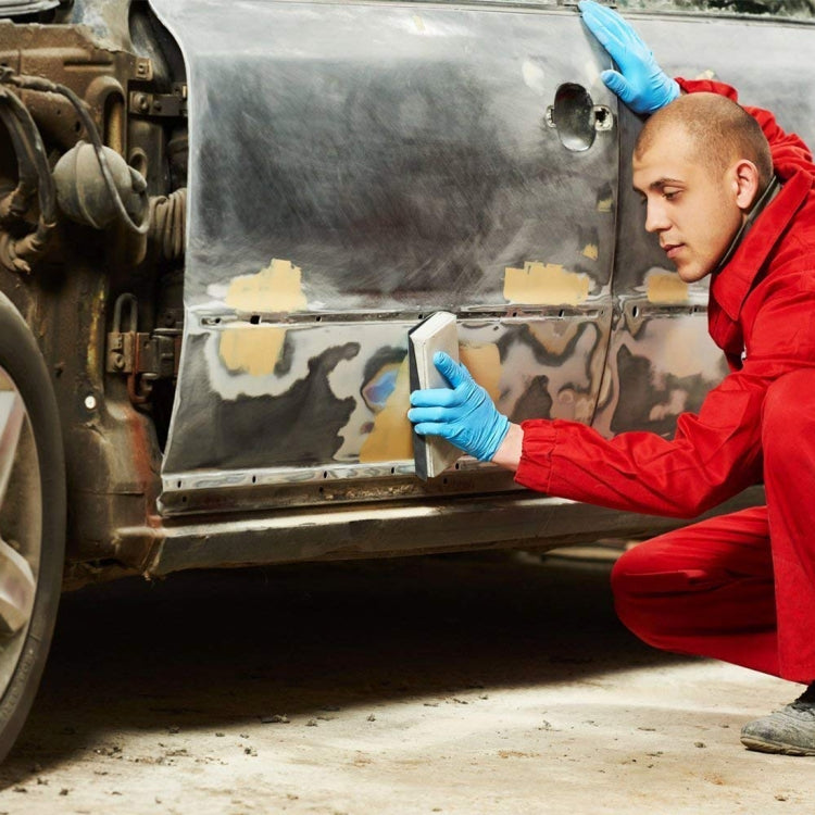 Auto-body wet and dry sanding using blue polishing sandpaper on a vehicle panel