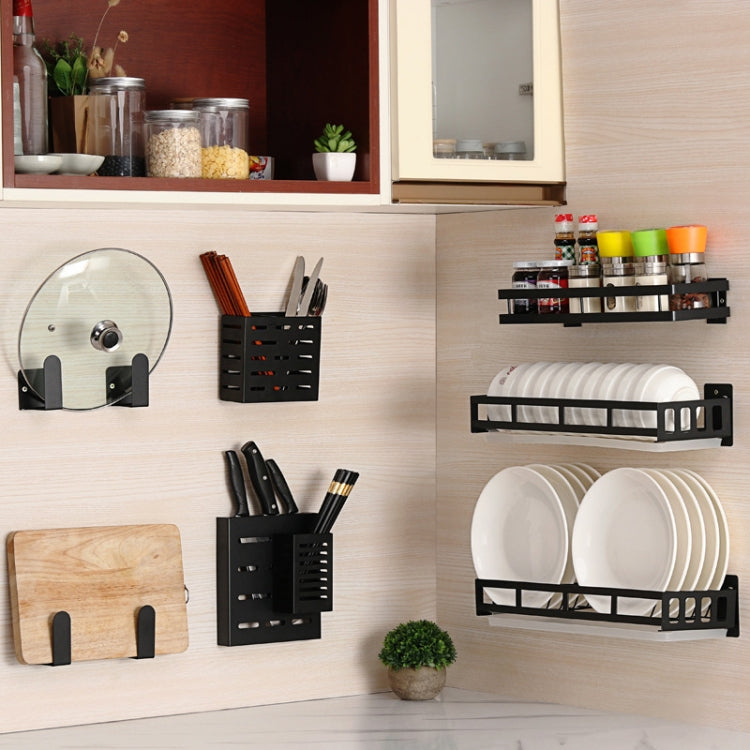 Wall-mounted kitchen rack set with knife holders and dish drainer on kitchen wall