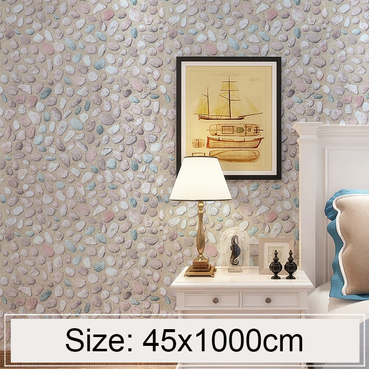 Pebble stone 3D wallpaper applied to wall with raised rock pattern in soft gray tones
