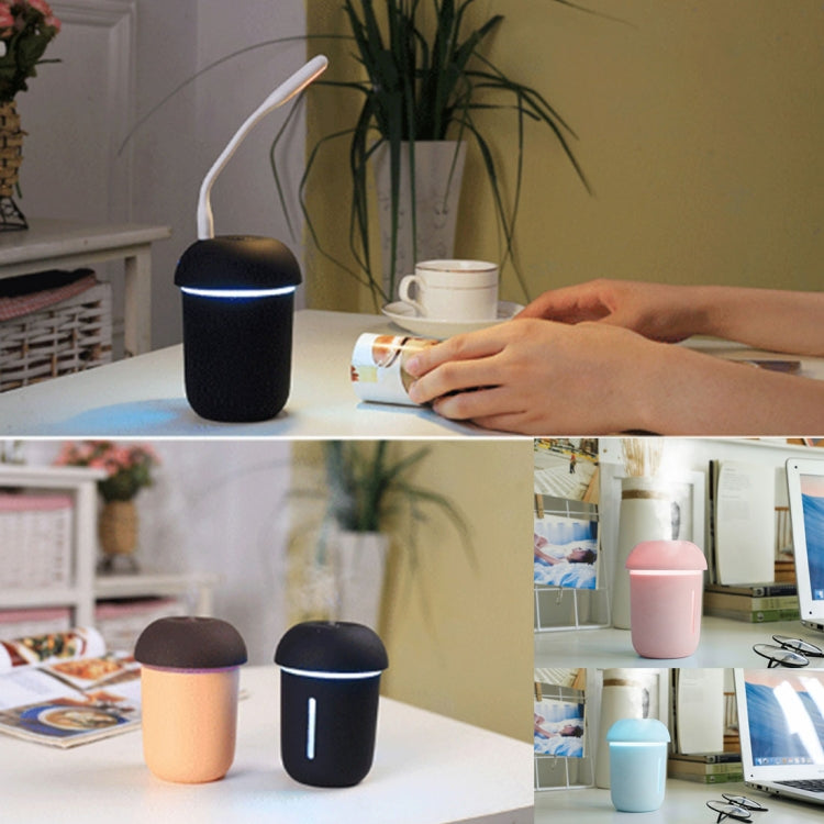 Mushroom USB aroma humidifiers on a tabletop in dark and pastel colors