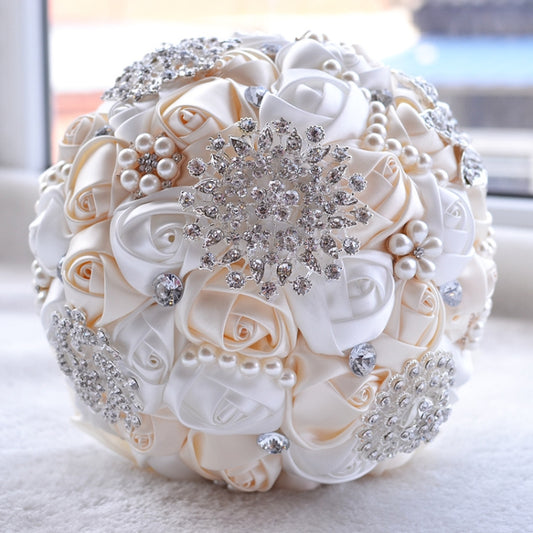 Ivory satin bridal bouquet with pearl beads and silver rhinestone floral center