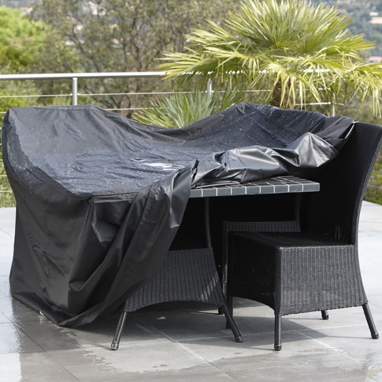 Outdoor chair set protective cover, black, draped over folding patio furniture