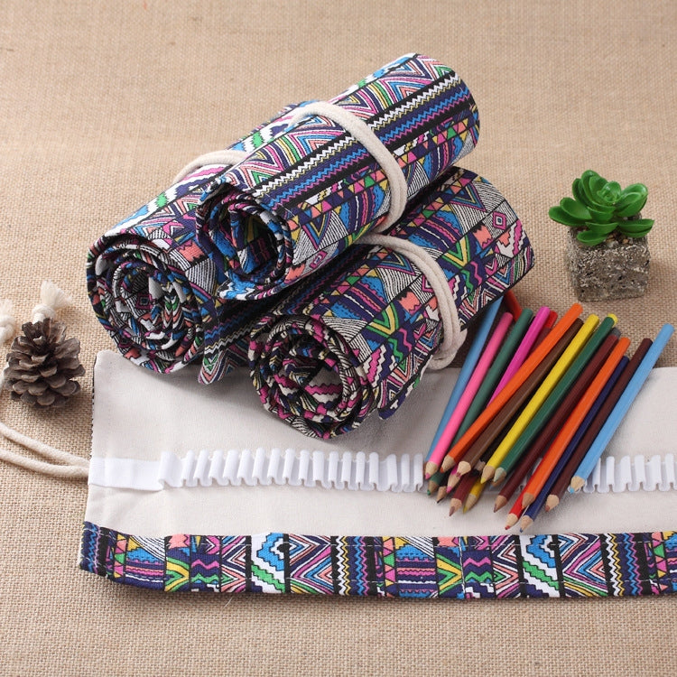 Rolled multicolor canvas pencil case with ethnic print, ties, and colored pencils inside