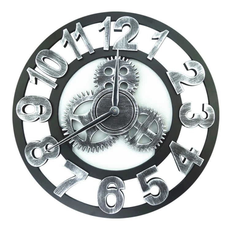 Silver round wall clock with large gear-style numerals and visible clock hands