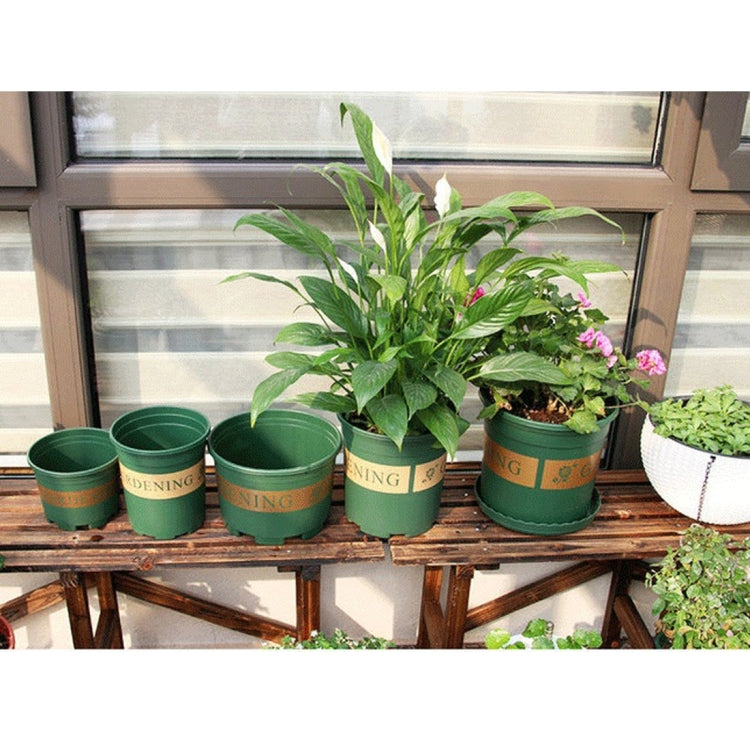 Assorted green plastic plant pots with GARDENING print, row of multiple sizes