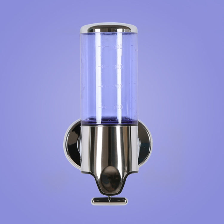 Wall-mounted manual soap dispenser with clear purple-tinted cylinder and chrome pump