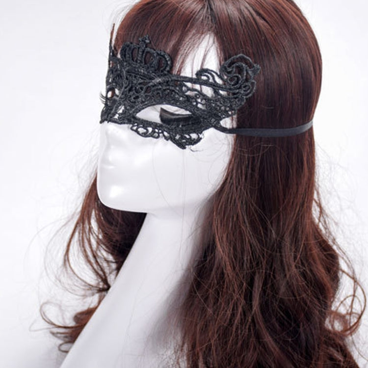 Black lace masquerade eye mask worn on hair, ornate crown front