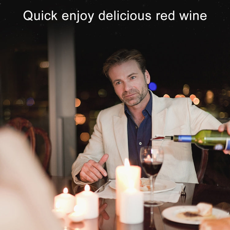 Wine pourer pouring wine at a table with glasses and candles