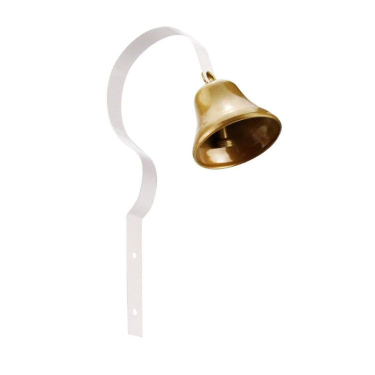 Metal wall bell with white strap and gold-toned bell, hanging loop with mount tab