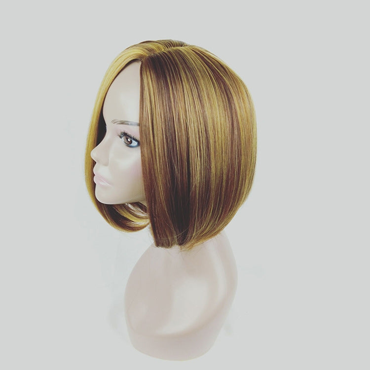 Linen-gold bob wig side view with layered texture and straight fringe, on mannequin