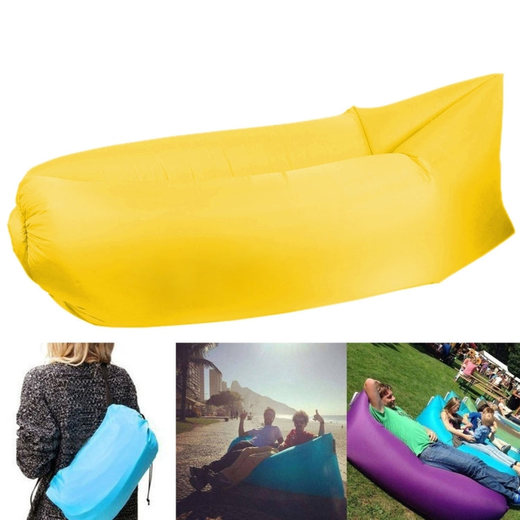 Yellow inflatable lounger sofa with cushioned air chamber and raised headrest