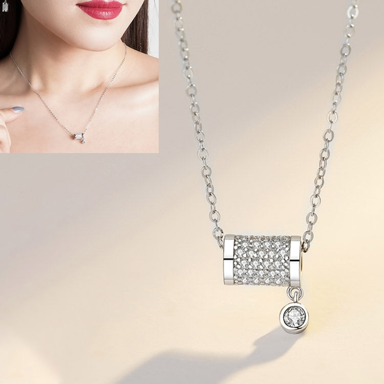 Silver chain necklace with rectangular crystal cuff pendant and small round dangling charm