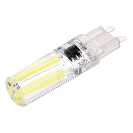Dimmable LED filament bulb with transparent glass and G9 base, warm white