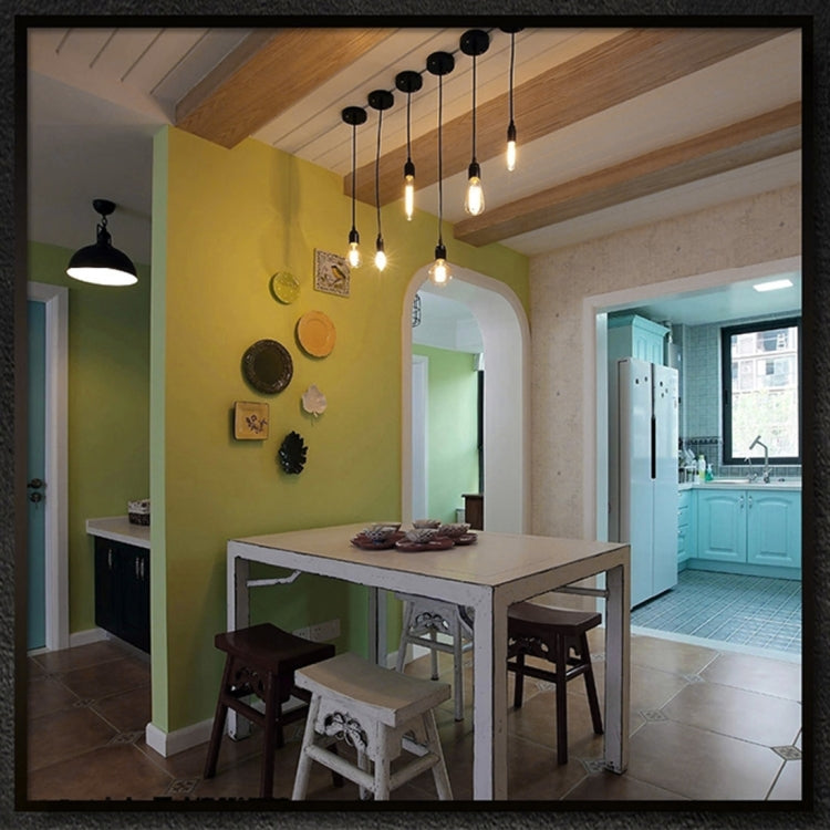 Dining room pendant lights using retro LED filament bulbs hanging from the ceiling