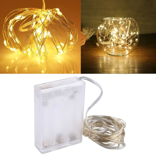 Warm yellow LED fairy string lights, silver wire with glowing micro LEDs