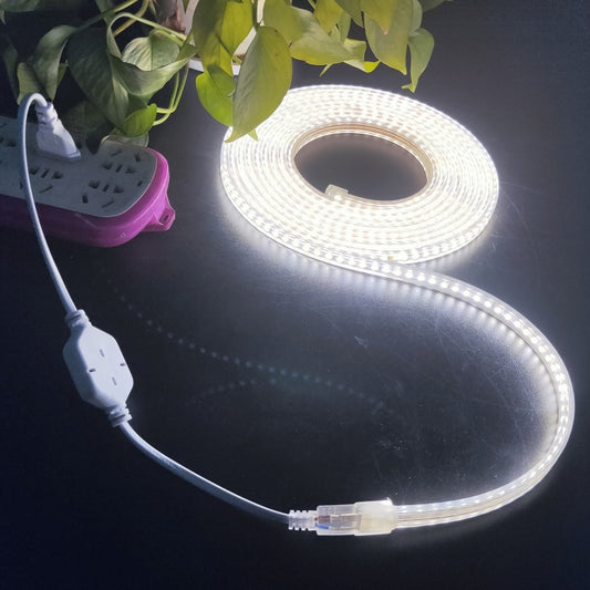 White LED strip light roll with open center loop and plug-in power cord