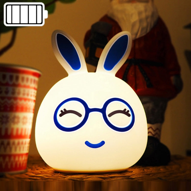 Battery LED rabbit night lamp with blue glowing closed eyes and smiling glasses face