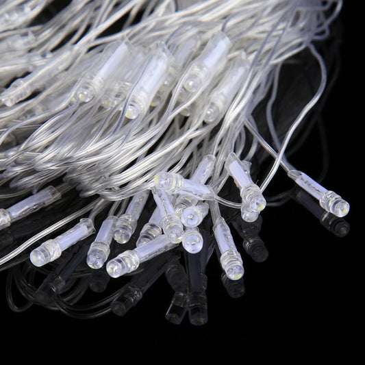 Close-up of clear LED string lights with small round bulbs on wire