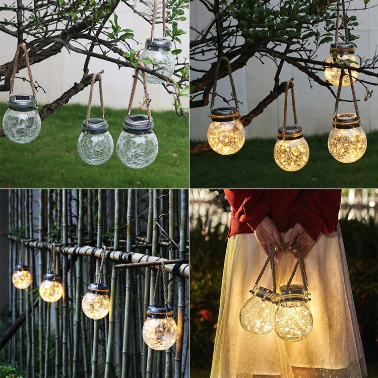 Solar glass bottle pendant lamp with clear glass bulb and metal cap, warm white glow