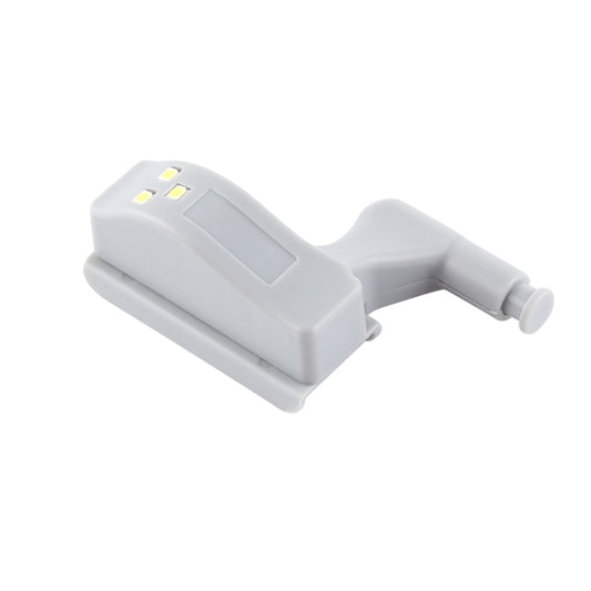 White LED hinge sensor night light with three LEDs, side view of mounting clip