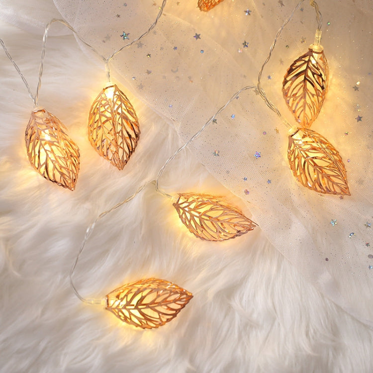 Rose gold leaf LED fairy lights with warm glowing leaf bulbs on wire string