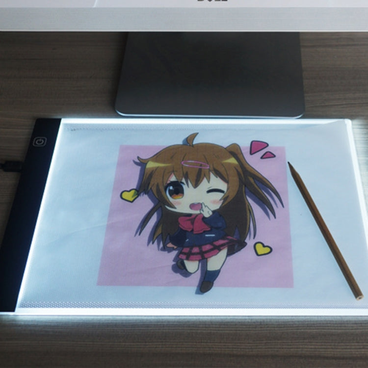 Portable A4 LED light box with glowing panel for tracing, anime-style artwork shown