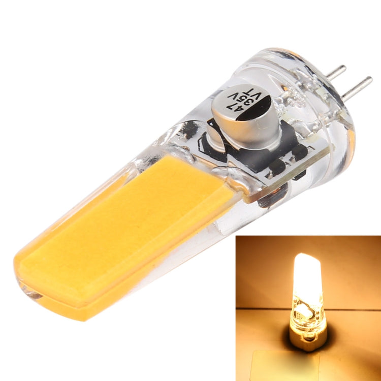 G4 warm white LED corn light bulb with clear lens, two pins, and lit inset
