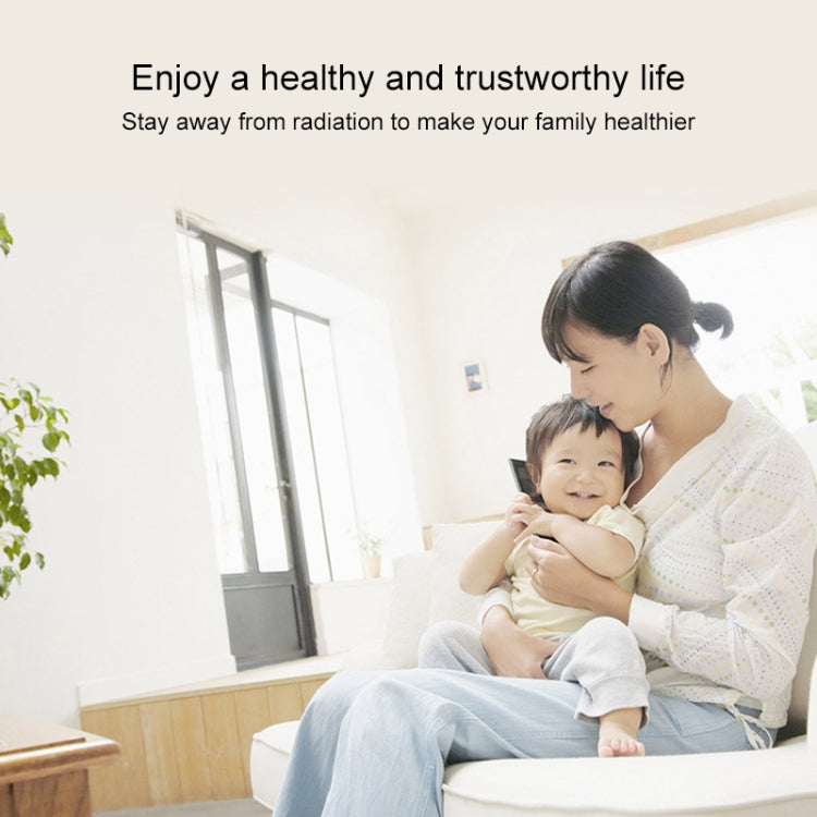 Cell signal booster lifestyle image with mother holding baby in a bright living room